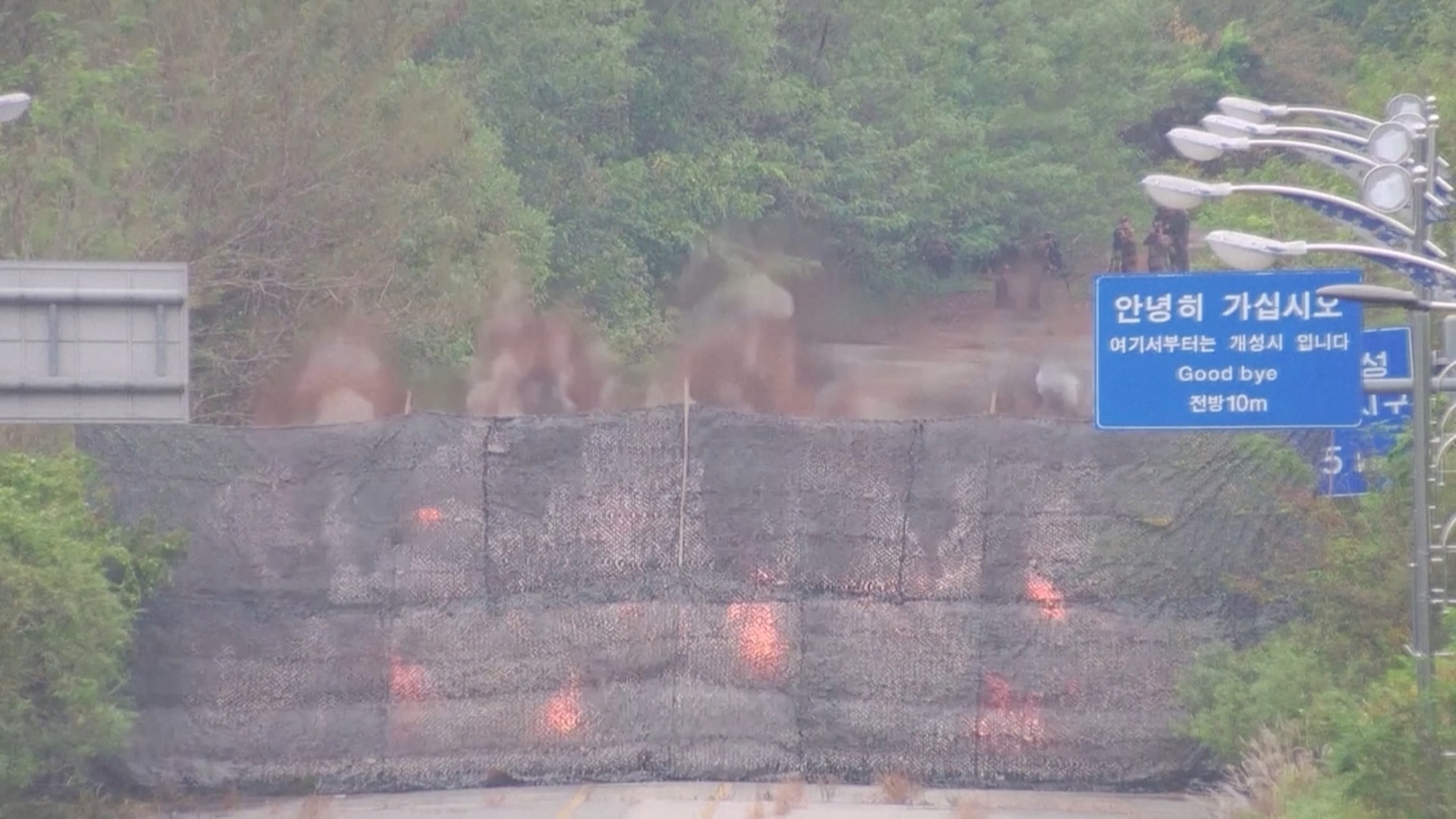 PHOTO: Fire and smoke rises after North Korea blows up sections of inter-Korean roads on its side of the border between the two Koreas, according to South Korea's military, as seen from the South Korean side, Oct. 15, 2024.